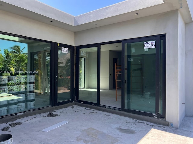 1700 NE 18th St, Fort Lauderdale, FL 33305 - doorway to property with stucco siding
