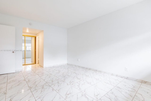 16985 SW 113th Ct Unit 31541E, Miami, FL 33157 - empty room with light marble finish flooring