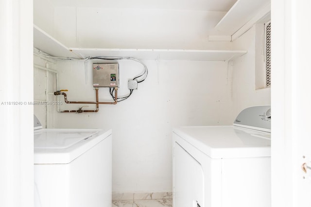 16985 SW 113th Ct Unit 31541E, Miami, FL 33157 - washroom featuring washer and dryer, water heater, and light marble finish flooring