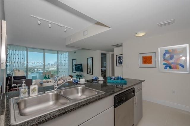 1861 NW S River Dr Unit 807, Miami, FL 33125 - kitchen with dishwasher, white cabinets, and rail lighting