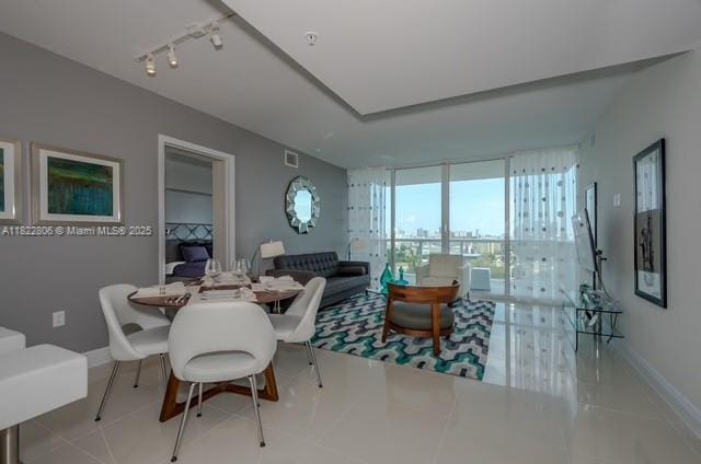 1861 NW S River Dr Unit 807, Miami, FL 33125 - tiled dining area with track lighting and a wall of windows