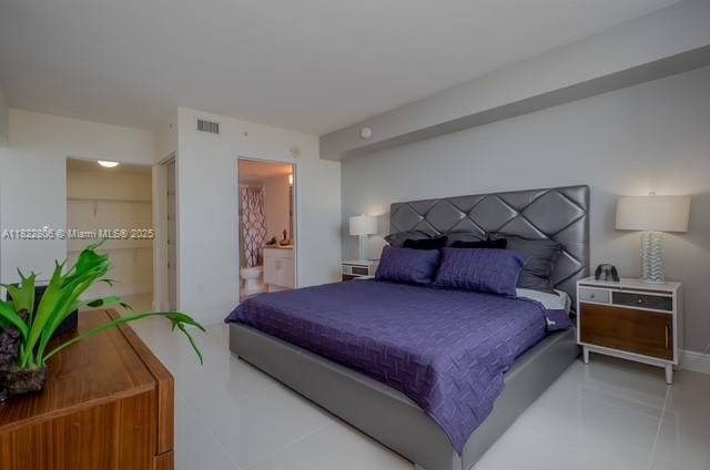1861 NW S River Dr Unit 807, Miami, FL 33125 - bedroom with tile patterned floors and ensuite bath
