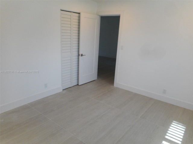 826 N 32nd Ct, Hollywood, FL 33021 - spare room with baseboards and light tile patterned floors