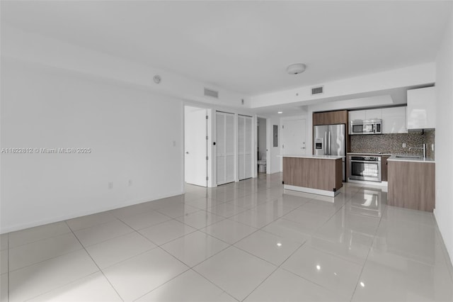 5252 NW 85th Ave Unit 1505, Doral, FL 33166 - unfurnished living room with light tile patterned flooring and a sink