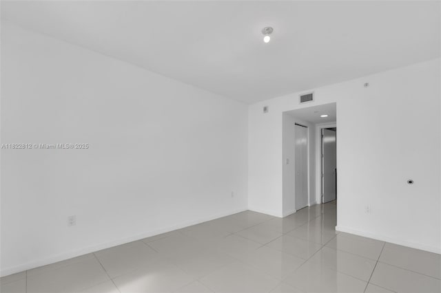 5252 NW 85th Ave Unit 1505, Doral, FL 33166 - empty room with baseboards and tile patterned floors