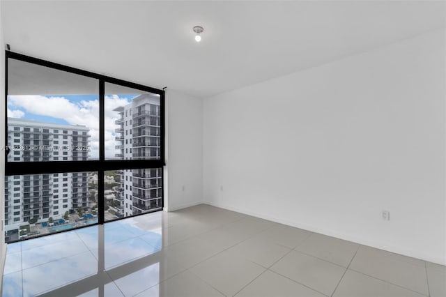 5252 NW 85th Ave Unit 1505, Doral, FL 33166 - spare room featuring expansive windows and a view of city