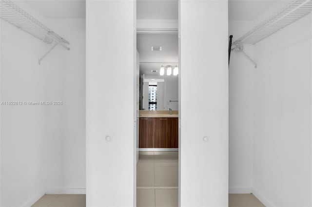 5252 NW 85th Ave Unit 1505, Doral, FL 33166 - walk in closet featuring a sink