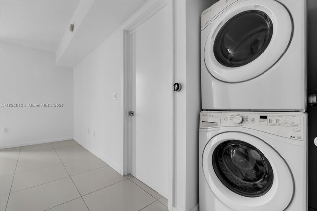 5252 NW 85th Ave Unit 1505, Doral, FL 33166 - laundry room with stacked washing machine and dryer and light tile patterned floors