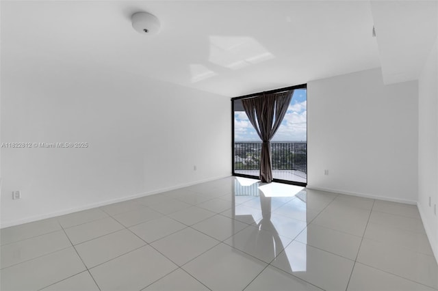 5252 NW 85th Ave Unit 1505, Doral, FL 33166 - unfurnished room featuring expansive windows and light tile patterned floors