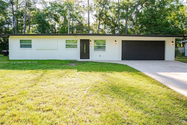 3313 N Ridge Rd, Tallahassee, FL 32305 - ranch-style home with an attached garage, concrete driveway, and a front lawn