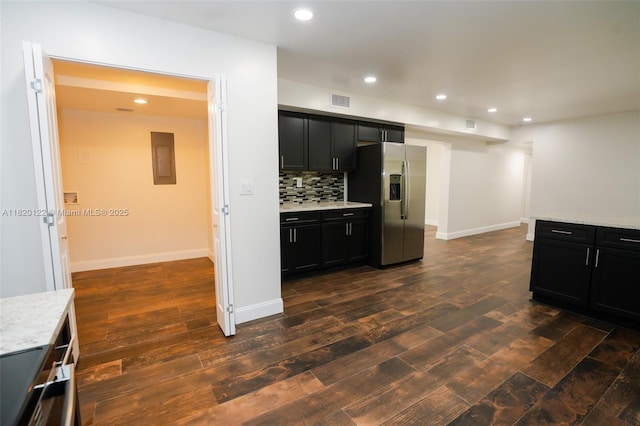 3313 N Ridge Rd, Tallahassee, FL 32305 - kitchen featuring stainless steel fridge with ice dispenser, dark cabinetry, dark wood-style flooring, electric panel, and recessed lighting