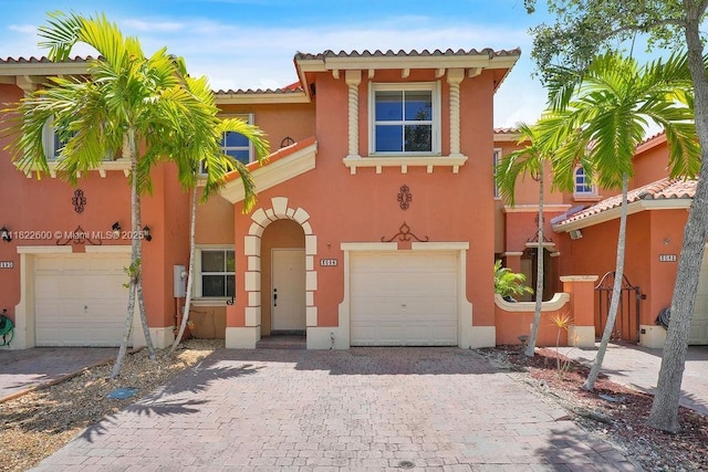 3086 SW 153rd Path, Miami, FL 33185 - view of front of home featuring an attached garage, stucco siding, decorative driveway, and a tile roof