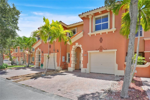 3086 SW 153rd Path, Miami, FL 33185 - view of front of property with an attached garage, stucco siding, decorative driveway, and a tile roof