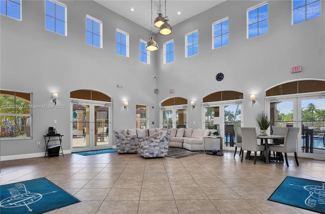 3086 SW 153rd Path, Miami, FL 33185 - tiled living area with french doors, a towering ceiling, healthy amount of natural light, and recessed lighting