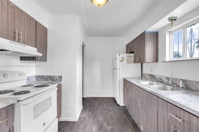 2135 NW 154th St, Miami Gardens, FL 33054 - kitchen featuring white appliances, under cabinet range hood, dark wood-style floors, and light countertops