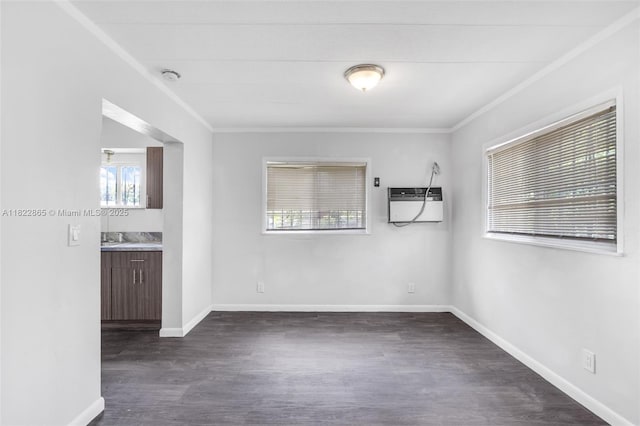 2135 NW 154th St, Miami Gardens, FL 33054 - empty room featuring plenty of natural light, a wall mounted air conditioner, dark wood-style floors, ornamental molding, and a smoke detector