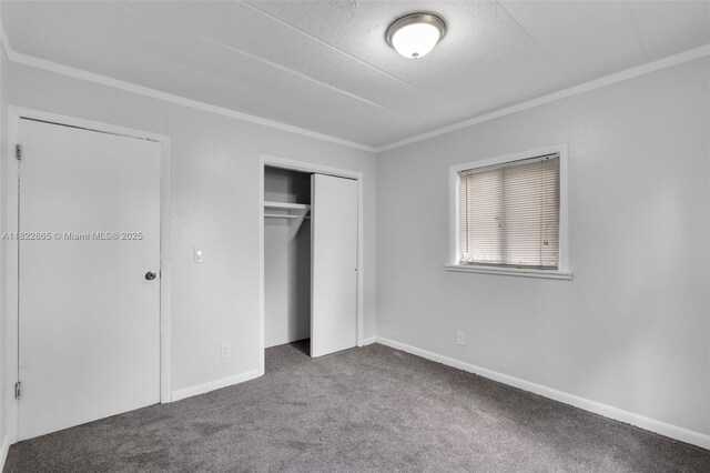 2135 NW 154th St, Miami Gardens, FL 33054 - unfurnished bedroom with carpet floors, ornamental molding, a closet, and a textured ceiling