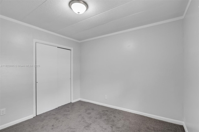 2135 NW 154th St, Miami Gardens, FL 33054 - unfurnished bedroom featuring carpet floors, ornamental molding, and a closet