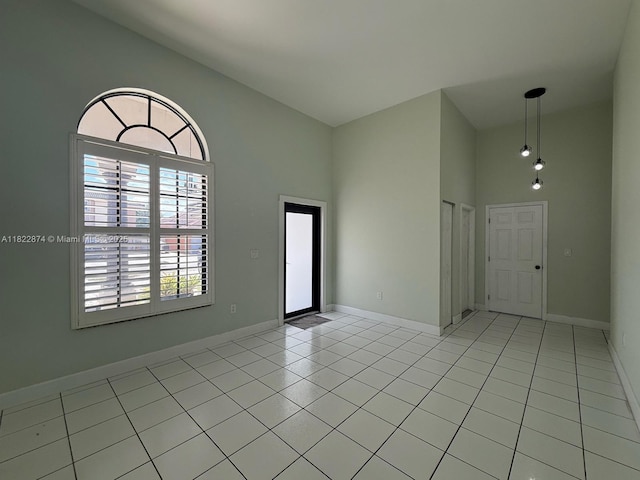 3461 SW 154th Ct, Miami, FL 33185 - empty room with high vaulted ceiling and light tile patterned floors