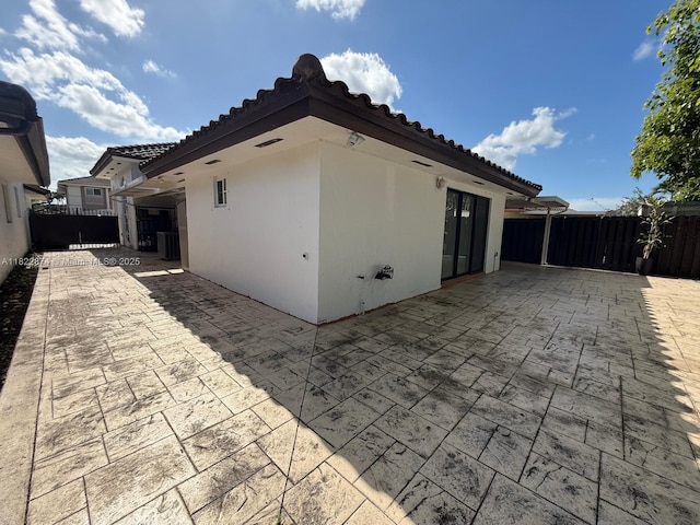 3461 SW 154th Ct, Miami, FL 33185 - back of house featuring a patio, stucco siding, and a tile roof