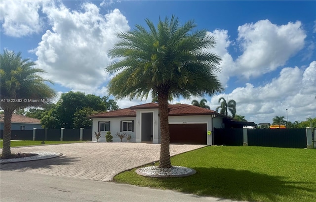 20401 SW 317th St, Homestead, FL 33030 - mediterranean / spanish-style house featuring stucco siding, decorative driveway, a garage, and a tile roof
