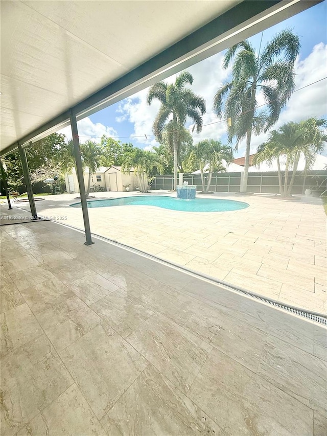 20401 SW 317th St, Homestead, FL 33030 - view of pool with a storage shed and a patio