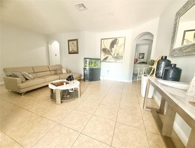 20401 SW 317th St, Homestead, FL 33030 - living room with arched walkways, light tile patterned floors, and recessed lighting