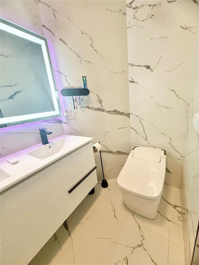 20401 SW 317th St, Homestead, FL 33030 - bathroom featuring marble tiled flooring, vanity, and stone wall