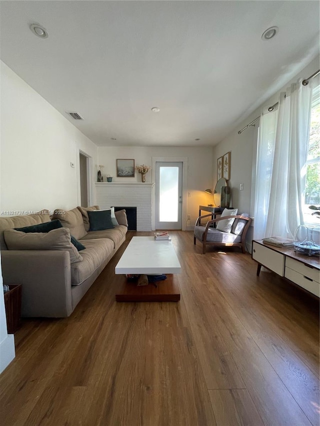 2985 Aviation Ave, Miami, FL 33133 - living area featuring wood finished floors and a fireplace