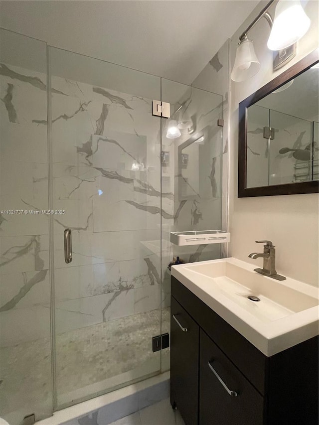 2985 Aviation Ave, Miami, FL 33133 - bathroom featuring vanity and a marble finish shower