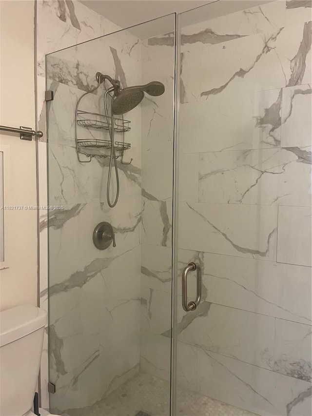 2985 Aviation Ave, Miami, FL 33133 - bathroom featuring a marble finish shower and toilet