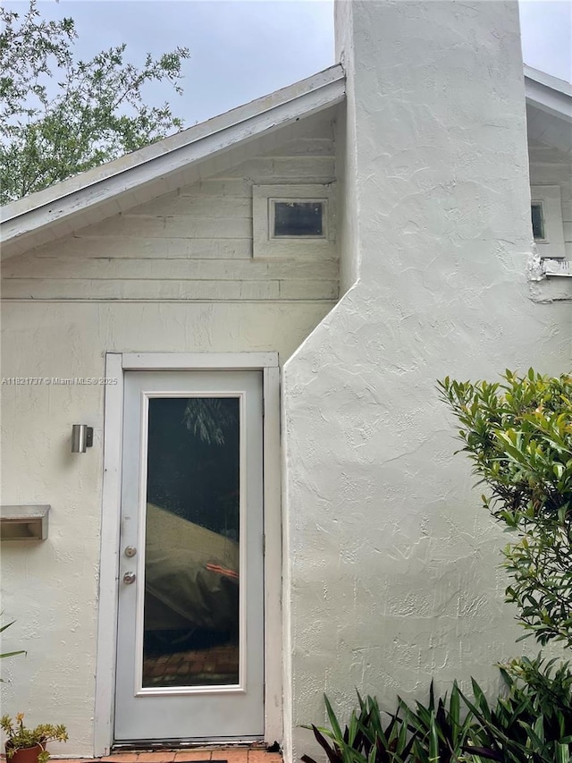 2985 Aviation Ave, Miami, FL 33133 - view of exterior entry featuring stucco siding
