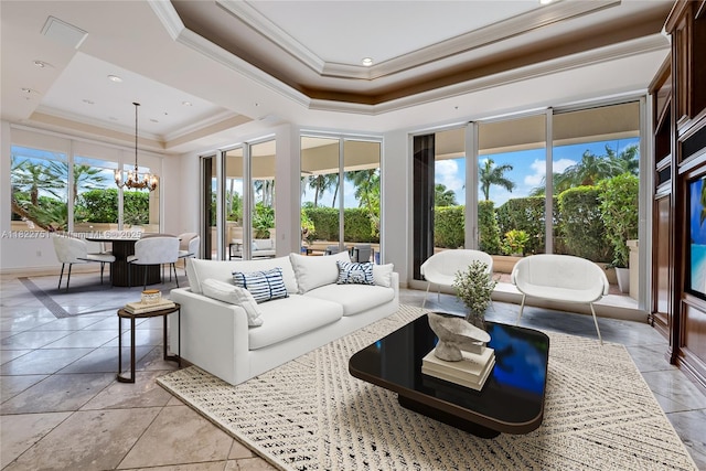 13611 Deering Bay Dr Unit 101, Coral Gables, FL 33158 - living room featuring a raised ceiling, crown molding, and a chandelier