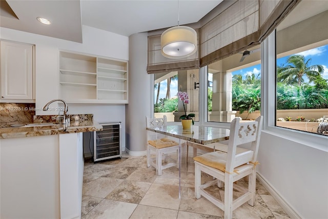 13611 Deering Bay Dr Unit 101, Coral Gables, FL 33158 - dining room featuring beverage cooler and baseboards
