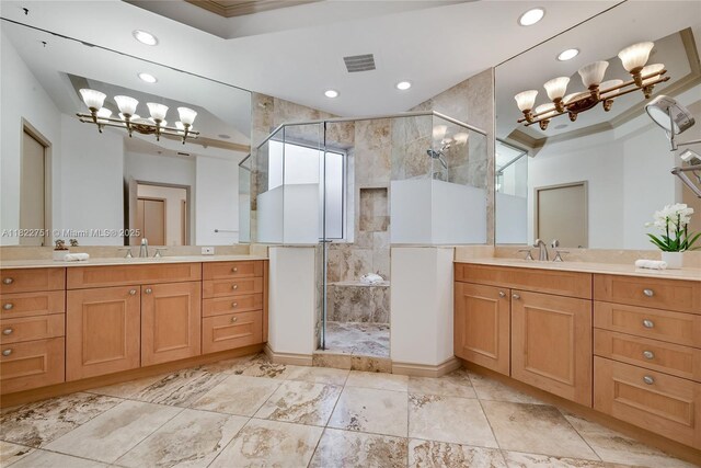13611 Deering Bay Dr Unit 101, Coral Gables, FL 33158 - full bath featuring a chandelier, a stall shower, recessed lighting, two vanities, and crown molding