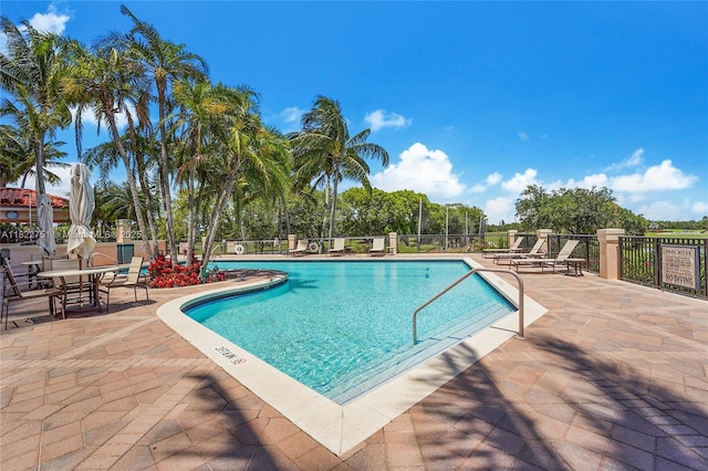 13611 Deering Bay Dr Unit 101, Coral Gables, FL 33158 - community pool featuring a patio area