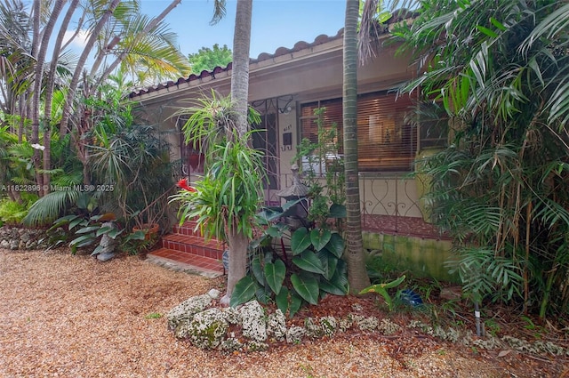 4187 S Le Jeune Rd, Miami, FL 33133 - view of home's exterior with a tiled roof