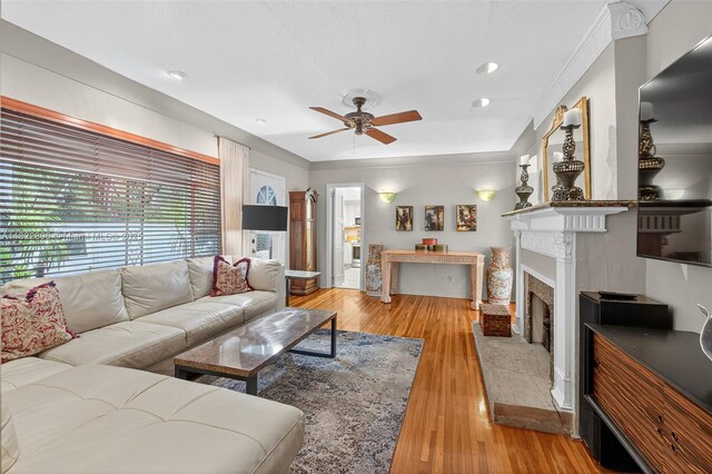 4187 S Le Jeune Rd, Miami, FL 33133 - living area with ceiling fan, light wood finished floors, a fireplace, and recessed lighting