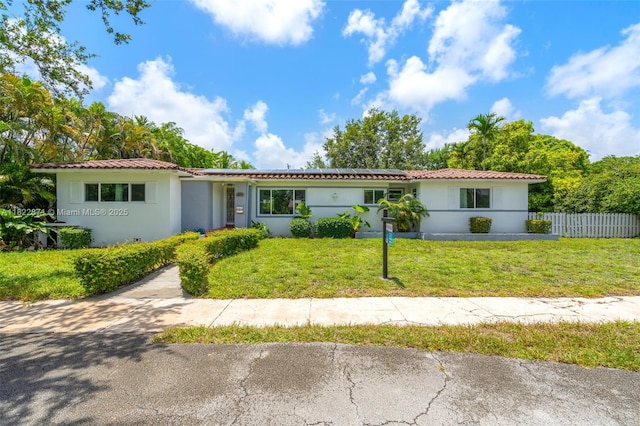 170 NW 105th St, Miami Shores, FL 33150 - ranch-style home featuring solar panels and stucco siding
