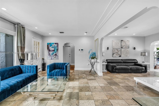 170 NW 105th St, Miami Shores, FL 33150 - living room with arched walkways, recessed lighting, ornamental molding, stone tile floors, and a baseboard radiator