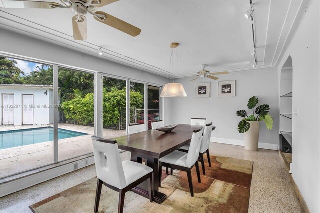 170 NW 105th St, Miami Shores, FL 33150 - dining room featuring rail lighting, ceiling fan, and speckle patterned floor
