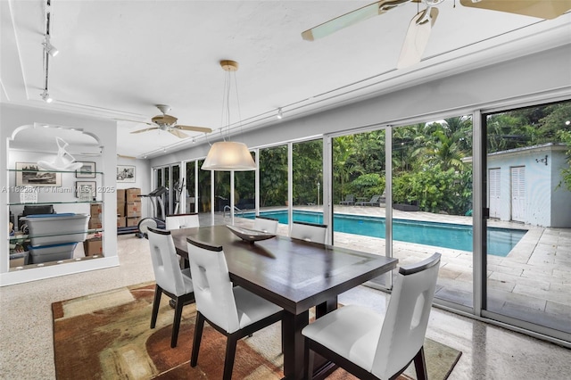 170 NW 105th St, Miami Shores, FL 33150 - dining room featuring a ceiling fan, rail lighting, and speckle patterned floor