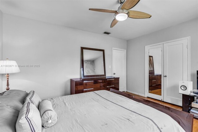 170 NW 105th St, Miami Shores, FL 33150 - bedroom featuring wood finished floors and ceiling fan