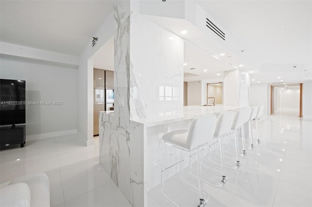 10205 Collins Ave Unit 1504, Bal Harbour, FL 33154 - hall with light tile patterned floors and recessed lighting