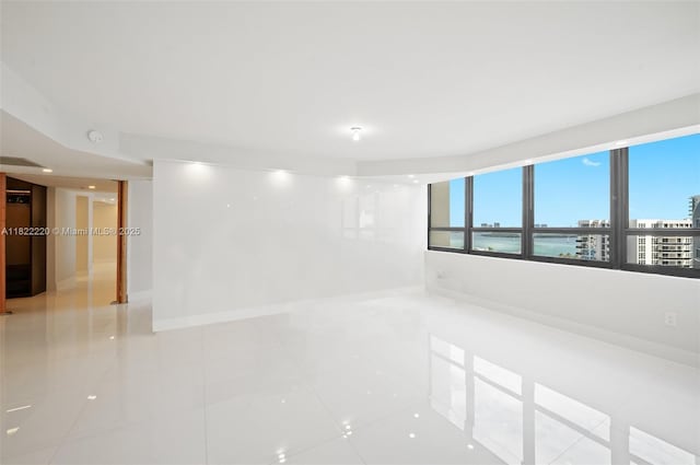 10205 Collins Ave Unit 1504, Bal Harbour, FL 33154 - unfurnished room featuring light tile patterned floors and a smoke detector