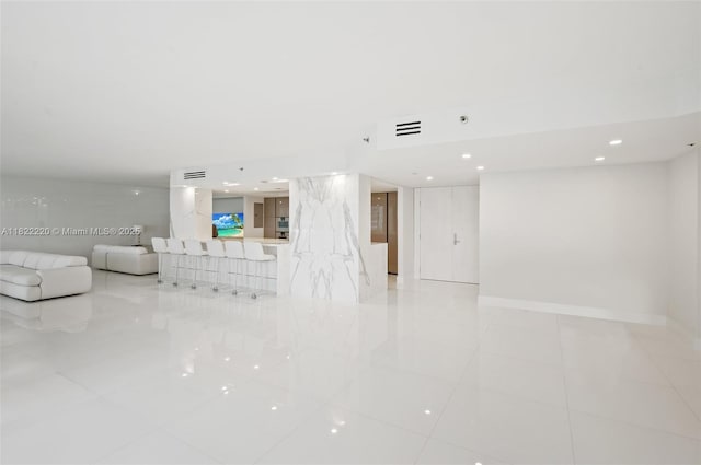 10205 Collins Ave Unit 1504, Bal Harbour, FL 33154 - unfurnished living room featuring recessed lighting and light tile patterned floors