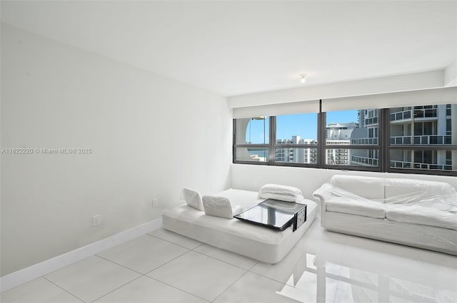 10205 Collins Ave Unit 1504, Bal Harbour, FL 33154 - tiled living room with baseboards and a city view