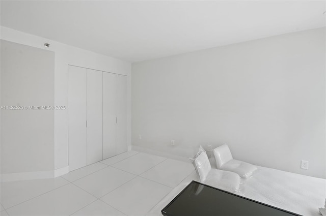 10205 Collins Ave Unit 1504, Bal Harbour, FL 33154 - unfurnished bedroom featuring tile patterned floors and a closet