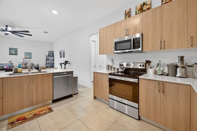 32106 SW 199th Pl, Homestead, FL 33030 - kitchen featuring stainless steel appliances, light countertops, a ceiling fan, and light tile patterned flooring