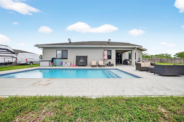 32106 SW 199th Pl, Homestead, FL 33030 - back of house featuring an outdoor living space, stucco siding, and a patio